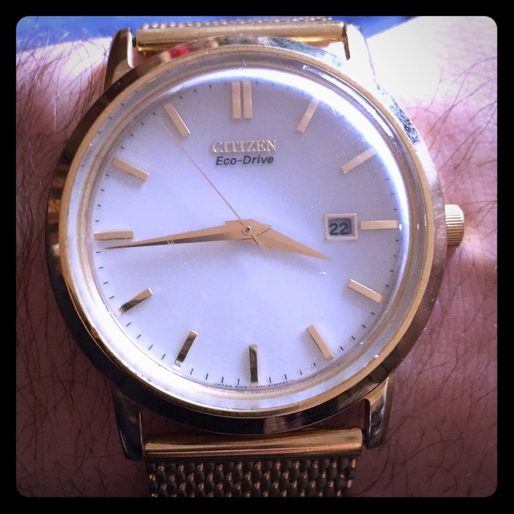 Citizens gold plated eco-drive watch white face.